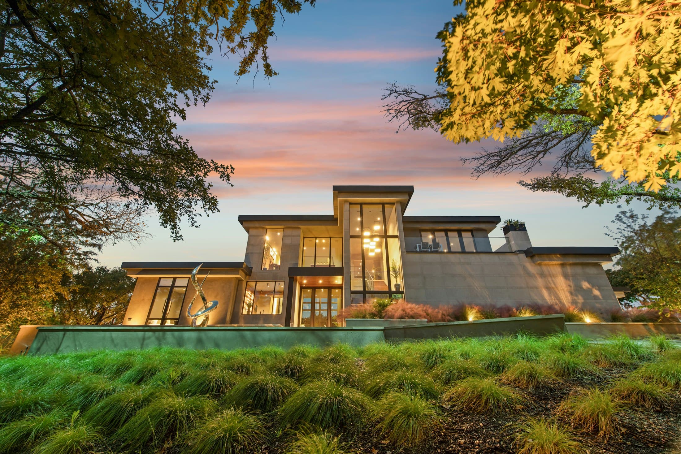 Modern house with expansive windows at twilight